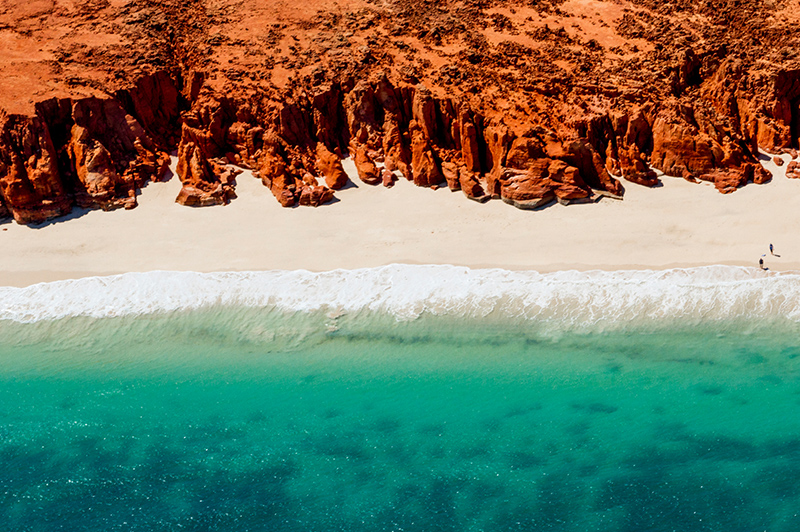 White sands, turquoise ocean and striking red Kooljaman Cliffs at Cape Leveque