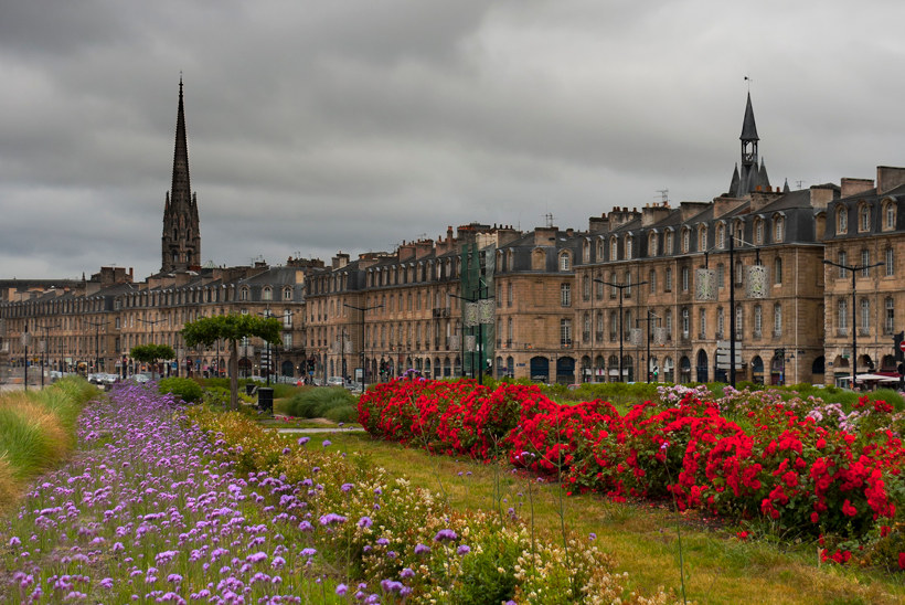 Travel Associates bordeaux houses with flowers in park infront