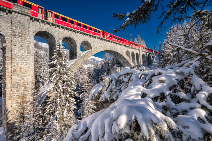 Travel Associates bernina express on bridge in snow