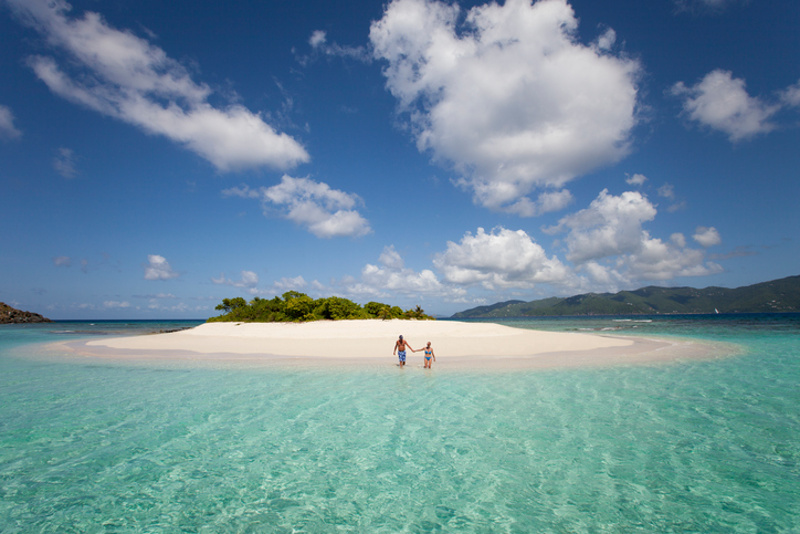 Couple swims at private island