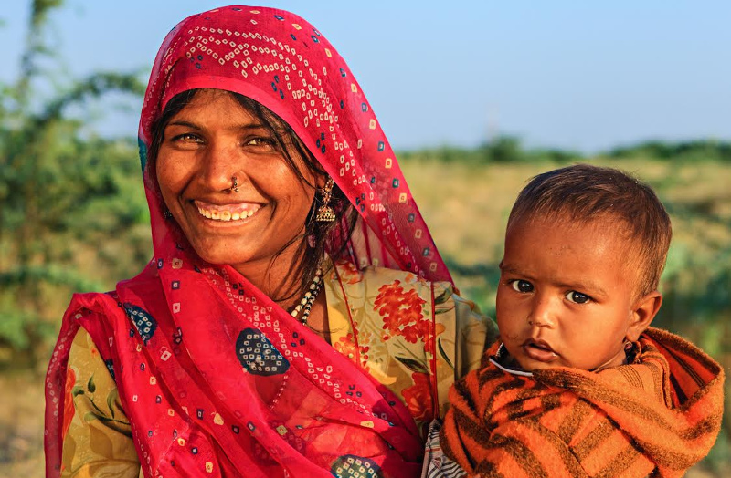 Mother and child in India smile for camera