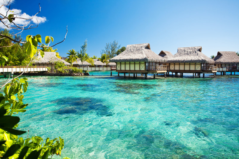 Overwater bungalows in turquoise waters