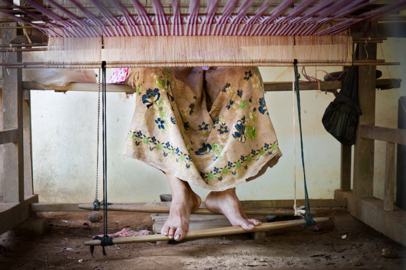 Lady's feet at weaving loom, Cambodia