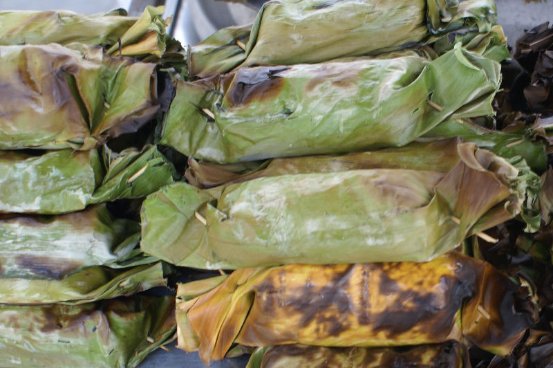 Leaf wrapped parcels of food cooked in a Tahitian ground oven