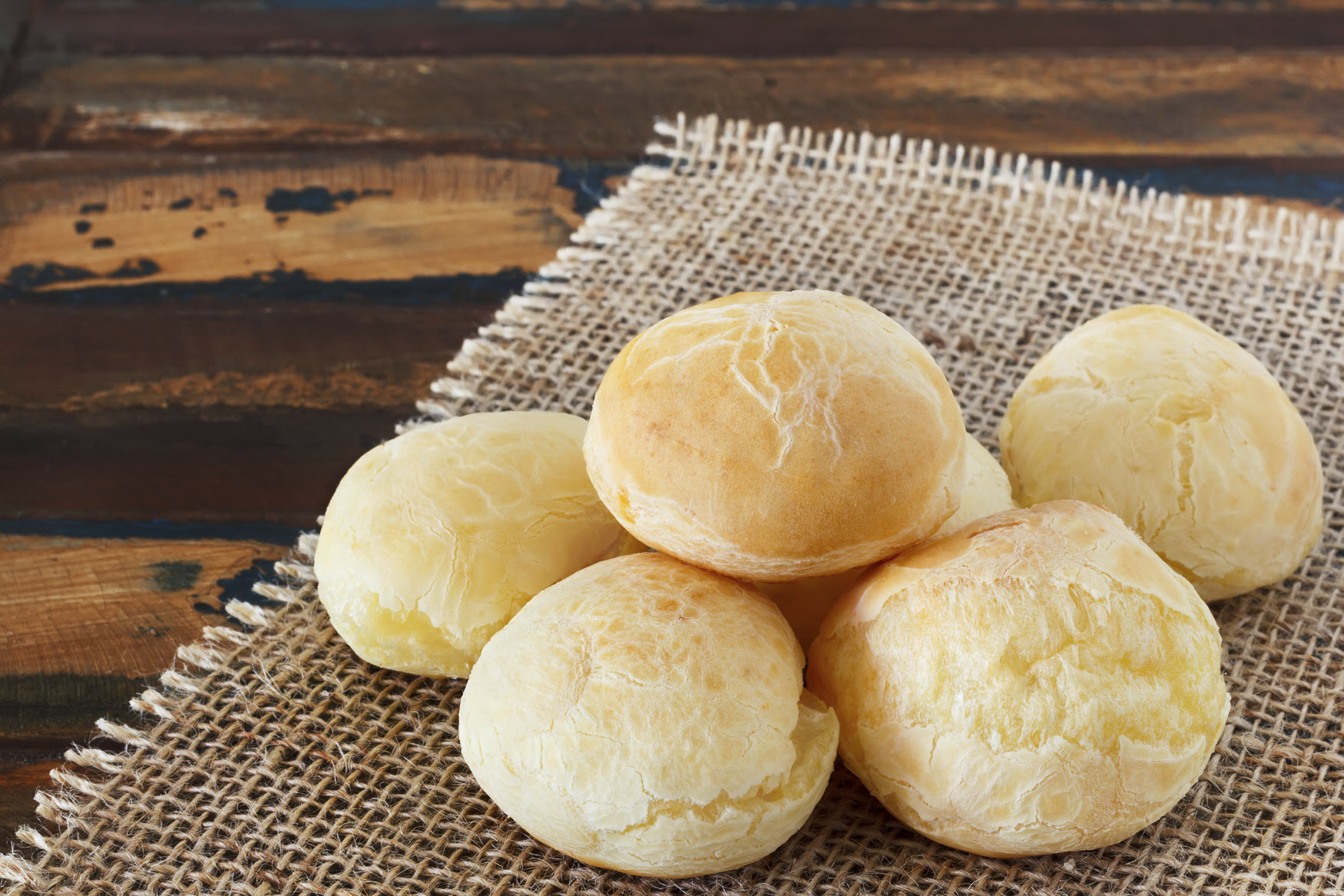 This image: Pao de queijo or cheese bread is a typical Brazilian snack.