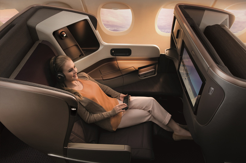 Image of lady enjoying Singapore Airlines Business Class