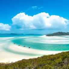 Clear blue water and white sandy beach