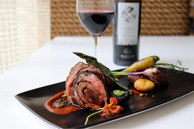 Grilled rolled skirt steak, hoja santa, guajillo puya and costeño pepper broth, potato, carrots and masa dumplings at XOCHI Grilled rolled skirt steak, hoja santa, guajillo puya and costeño pepper broth, potato, carrots and masa dumplings at XOCHI