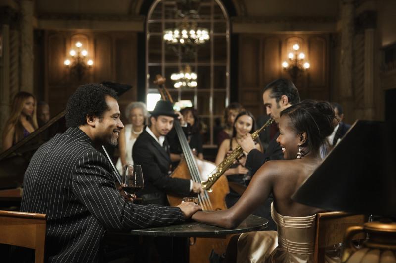 Couple watches live jazz concert in club