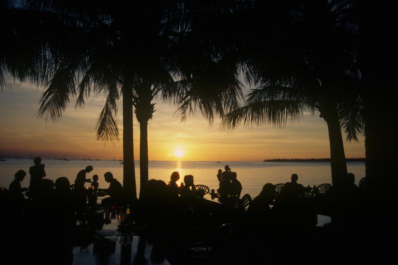 People enjoy a sunset at one of many Darwin Harbour watering holes