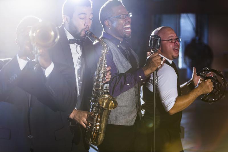 Four musicians playing jazz instruments