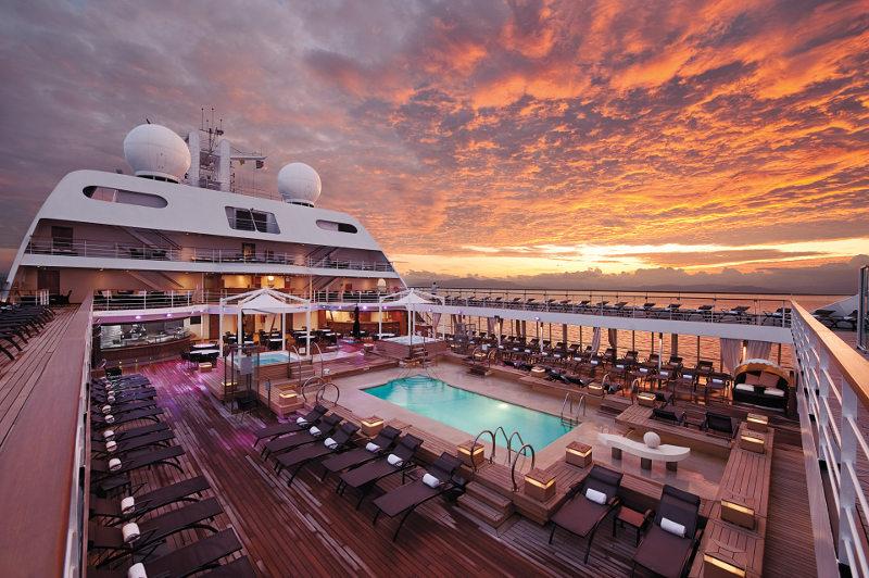 Luxury cruise ship deck with pool and deck chairs